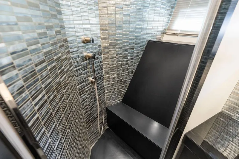 Slide: The Image of Luxurious shower area in 2019 Pershing 9X yacht with modern tile design. - 64
