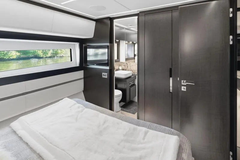 Slide: The Image of Luxurious interior of 2019 Pershing 9X yacht with modern bedroom and ensuite bathroom. - 66