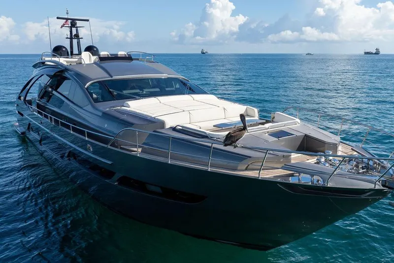Slide: The Image of Luxurious 2019 Pershing 9X yacht cruising on calm blue waters. - 7