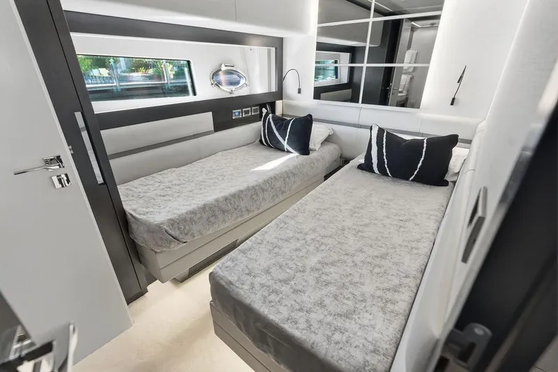Slide: The Image of Luxurious twin bedroom in 2019 Pershing 9X yacht with modern decor. - 71