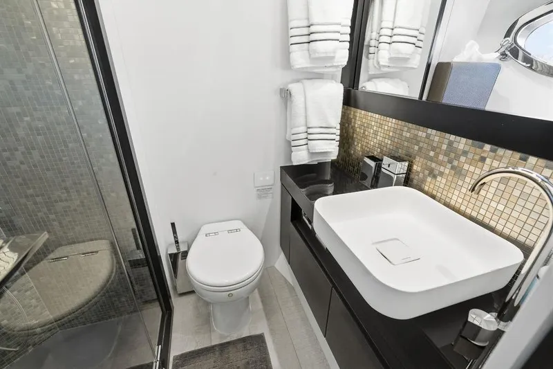 Slide: The Image of Luxurious bathroom in 2019 Pershing 9X yacht with modern fixtures and elegant design. - 73