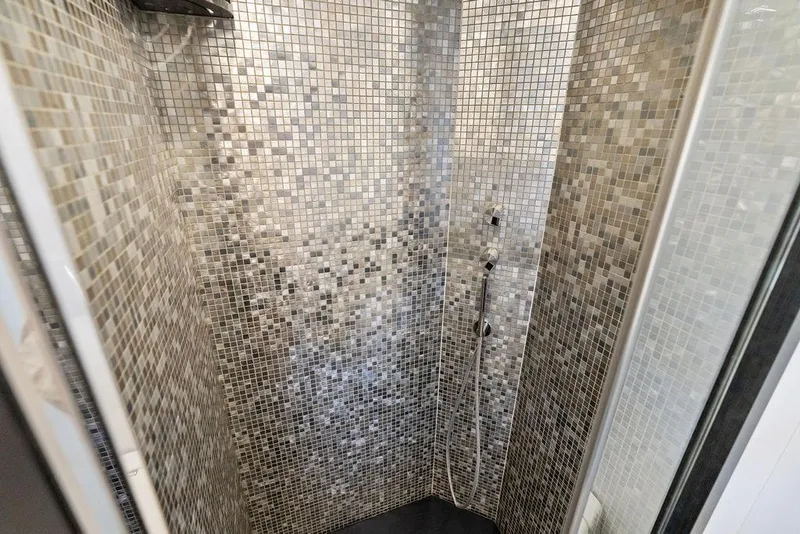 Slide: The Image of Luxurious mosaic-tiled shower in 2019 Pershing 9X yacht bathroom. - 74