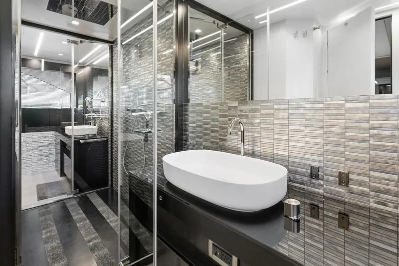 Slide: The Image of Luxurious bathroom interior on a 2019 Pershing 9X yacht, featuring modern design and sleek fixtures. - 77