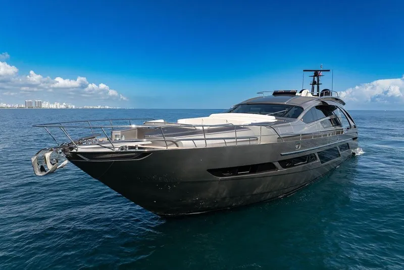 Slide: The Image of Luxurious 2019 Pershing 9X yacht cruising on open sea under clear blue sky. - 8