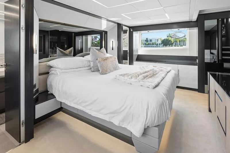 Slide: The Image of Luxurious bedroom interior on 2019 Pershing 9X yacht, featuring modern design and elegant decor. - 80