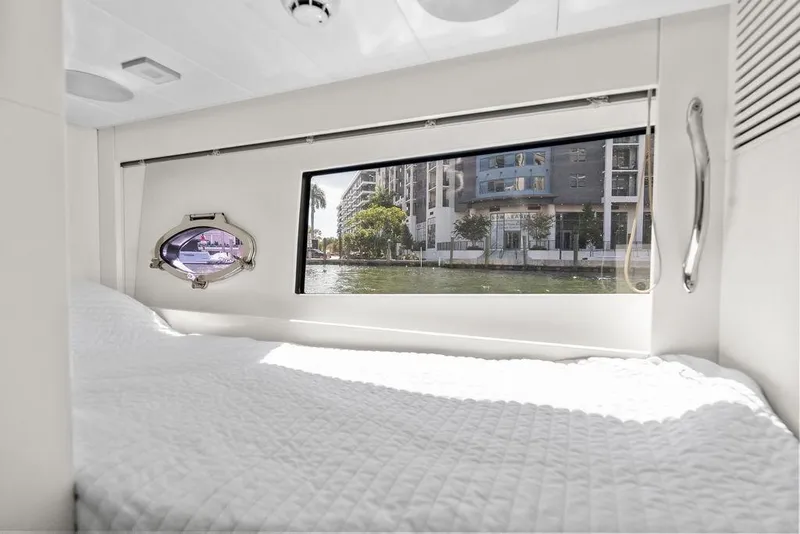 Slide: The Image of Luxurious interior cabin of 2019 Pershing 9X yacht with waterfront view. - 87
