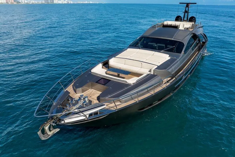 Slide: The Image of Luxurious 2019 Pershing 9X yacht cruising on clear blue ocean waters. - 9
