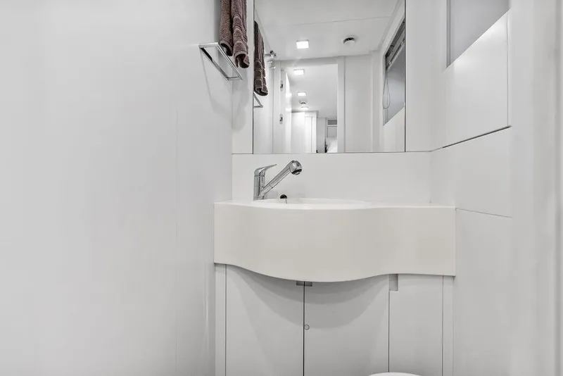 Slide: The Image of Modern bathroom interior on 2019 Pershing 9X yacht, featuring sleek white design and fixtures. - 90