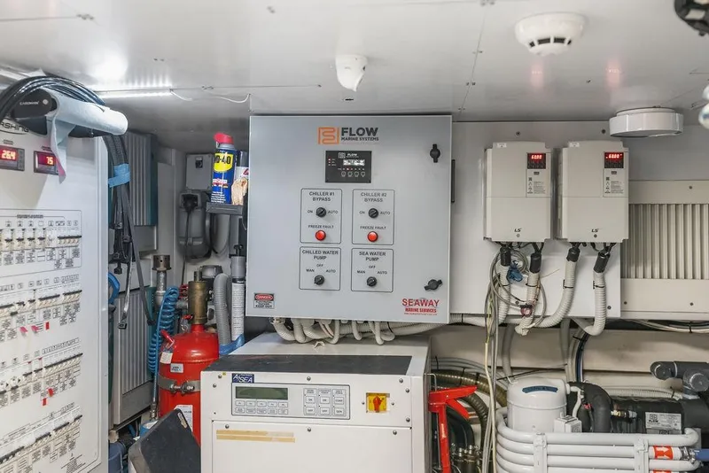 Slide: The Image of Engine room of 2019 Pershing 9X yacht with control panels and equipment. - 96