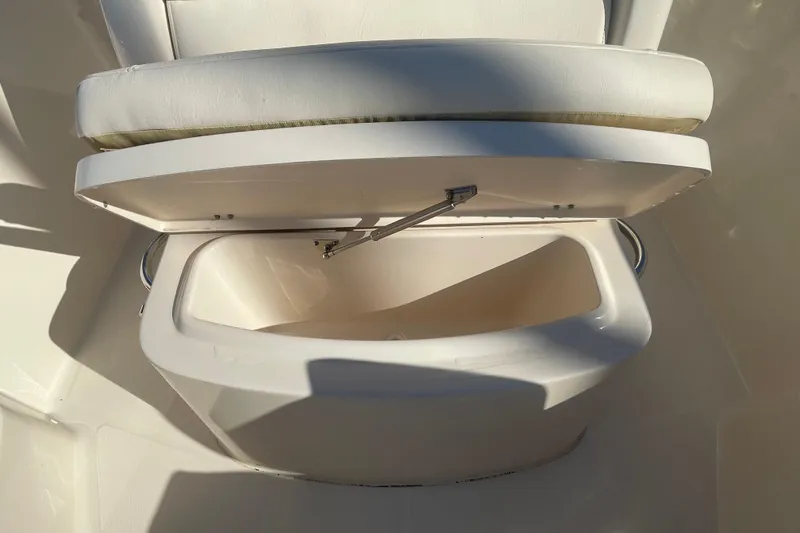 Slide: The Image of 2023 Grady-White Fisherman 236 boat seat with open storage compartment. - 19