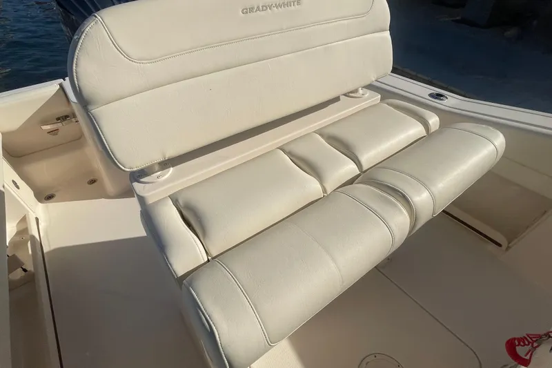 Slide: The Image of 2023 Grady-White Fisherman 236 boat seat, featuring plush white upholstery. - 22