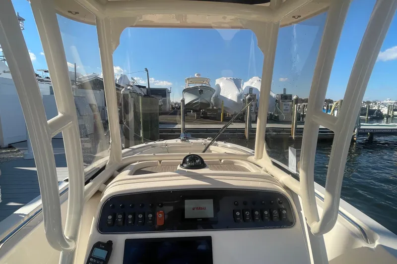 Slide: The Image of 2023 Grady-White Fisherman 236 boat dashboard view at marina. - 26