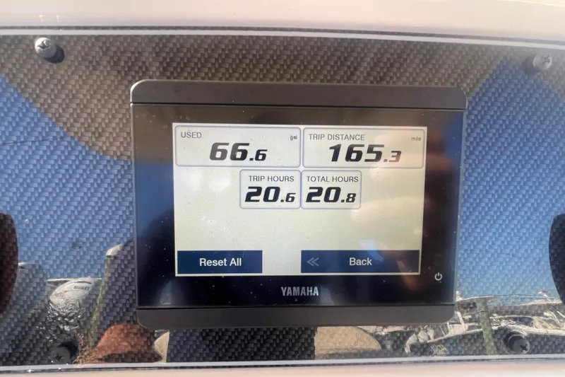 Slide: The Image of Yamaha display on 2023 Grady-White Fisherman 236 showing trip data and fuel usage. - 27