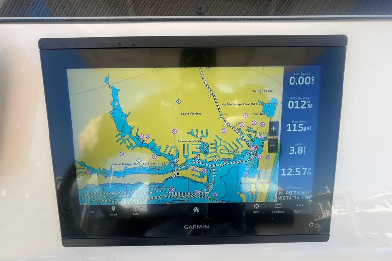 Slide: The Image of Garmin marine GPS display on 2023 Grady-White Fisherman 236 boat, showing navigation map. - 28