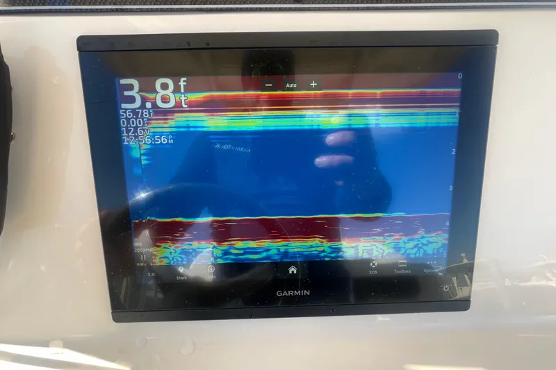Slide: The Image of Garmin fishfinder display on 2023 Grady-White Fisherman 236, showing depth and temperature. - 29