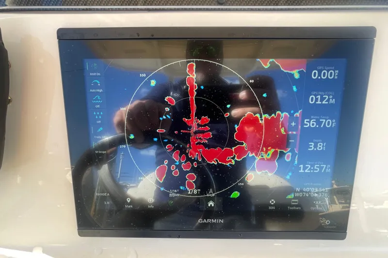 Slide: The Image of Garmin marine radar display on 2023 Grady-White Fisherman 236 boat dashboard. - 30
