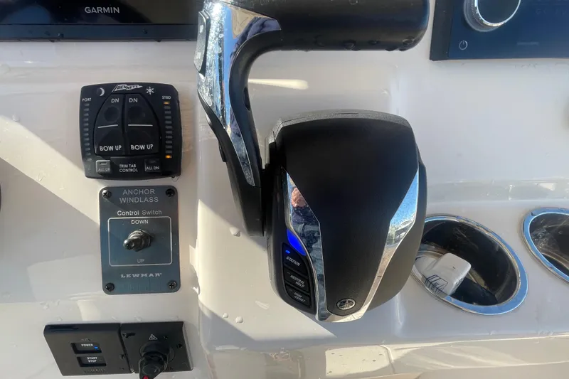 Slide: The Image of Control panel of 2023 Grady-White Fisherman 236 boat with anchor windlass and throttle controls. - 33