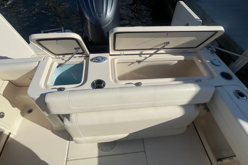 Slide: The Image of 2023 Grady-White Fisherman 236 boat with open storage compartments and seating. - 35