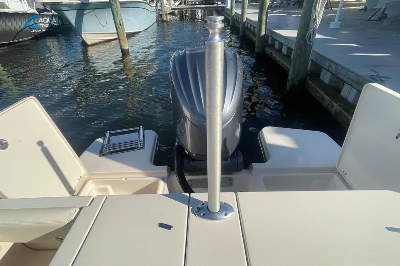 Slide: The Image of 2023 Grady-White Fisherman 236 boat stern view with outboard motor at dock. - 43