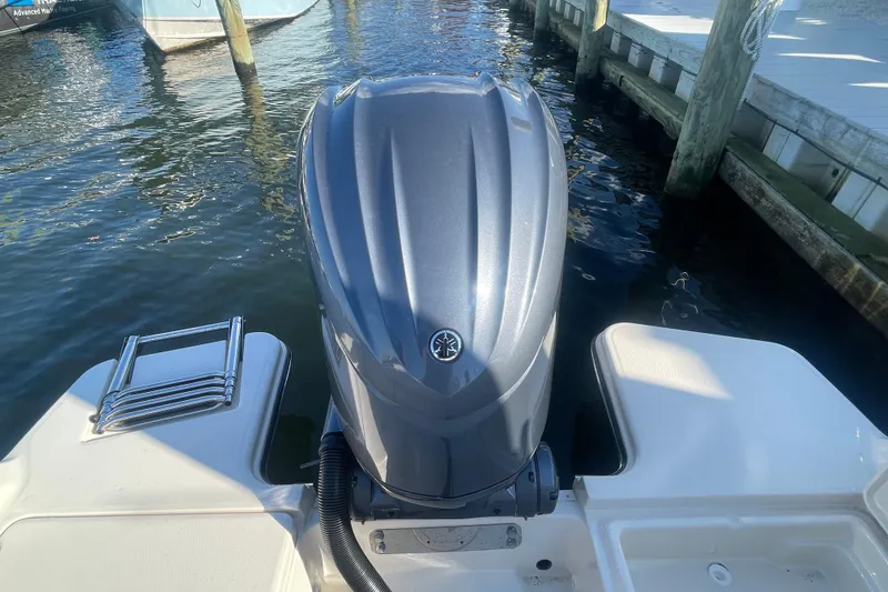 Slide: The Image of 2023 Grady-White Fisherman 236 boat engine at dockside, featuring a sleek design. - 47