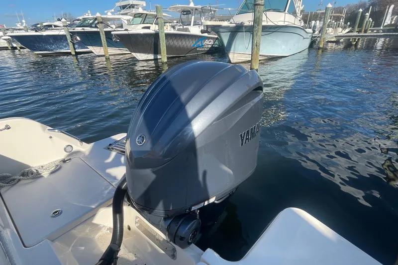 Slide: The Image of 2023 Grady-White Fisherman 236 with Yamaha outboard motor docked at marina. - 48
