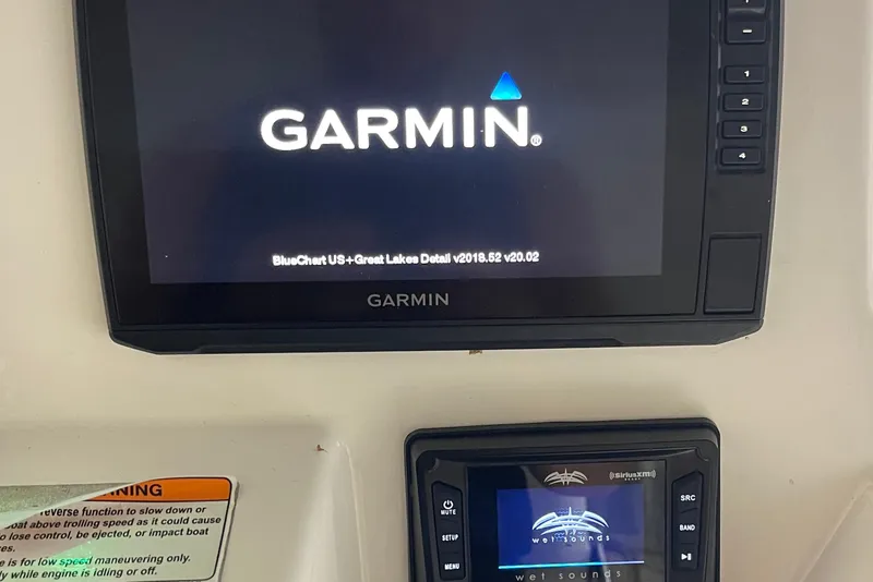 Slide: The Image of Garmin and Wet Sounds displays on 2019 Yamaha Boats 210 FSH dashboard. - 4