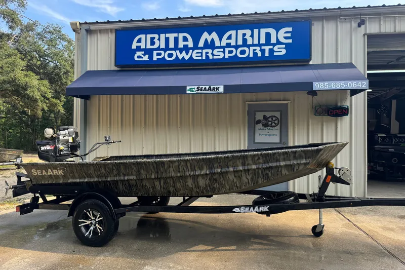 The Image of 2025 SeaArk 1660 MVT boat on trailer at Abita Marine & Powersports dealership. - 1