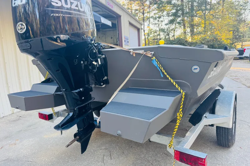 Slide: The Image of 2025 SeaArk 1660 MVT boat with Suzuki 60HP engine on trailer. - 15