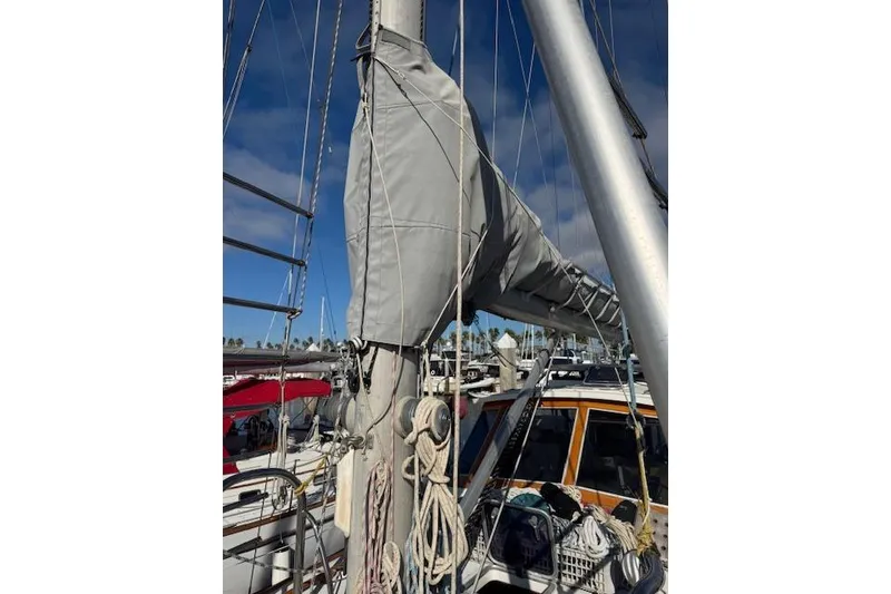 Slide: The Image of 1973 Maple Leaf Center Cockpit sailboat mast and rigging at marina. - 26