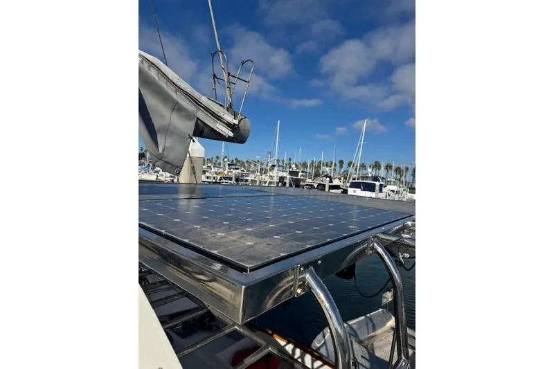 Slide: The Image of Solar panel on 1973 Maple Leaf Center Cockpit sailboat, docked in marina under blue sky. - 30