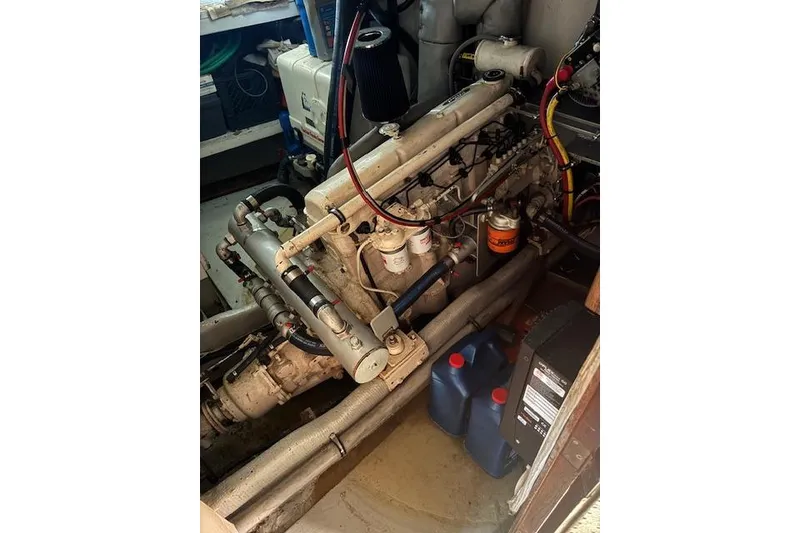 Slide: The Image of Engine room of a 1973 Maple Leaf Center Cockpit sailboat, showcasing mechanical components. - 7