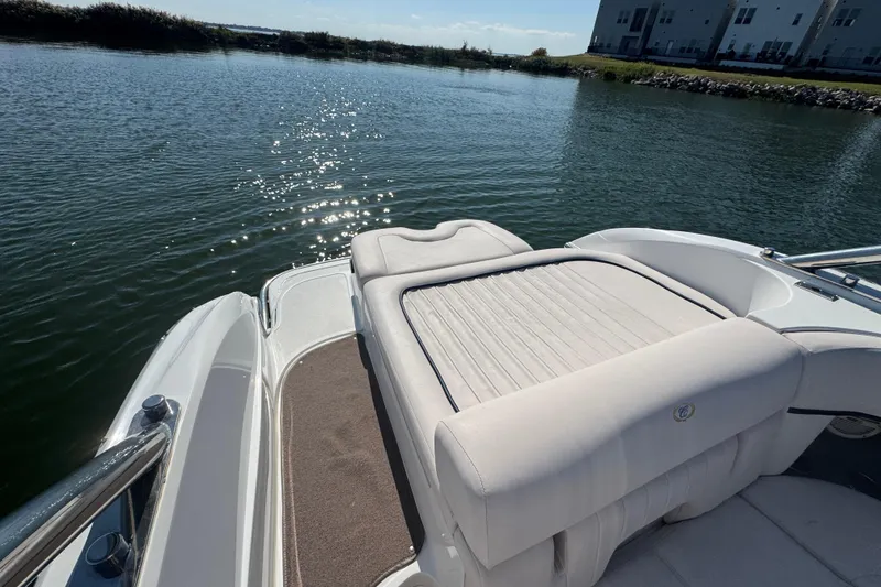 Slide: The Image of 2006 Cobalt 272 boat with sun pad, on calm water, sunny day. - 21