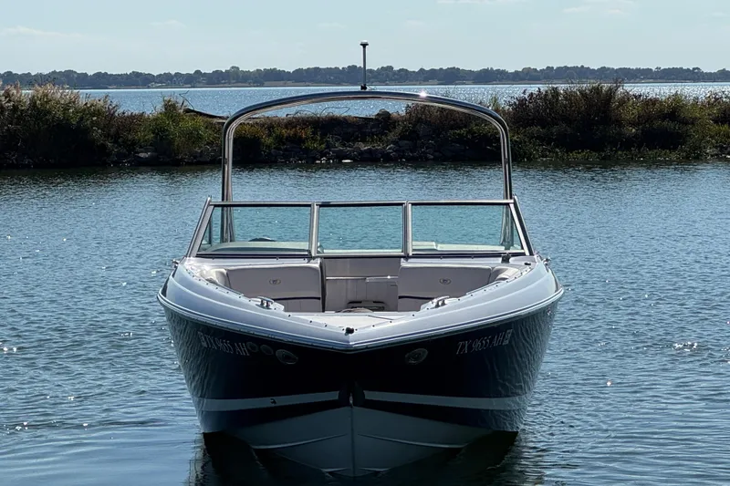 Slide: The Image of 2006 Cobalt 272 boat on calm water with scenic background. - 3