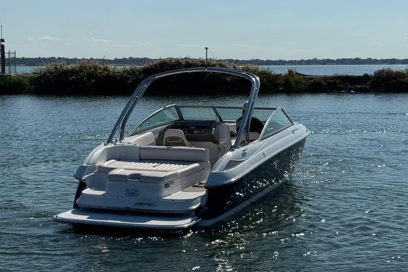 Slide: The Image of 2006 Cobalt 272 boat cruising on a sunny lake. - 6