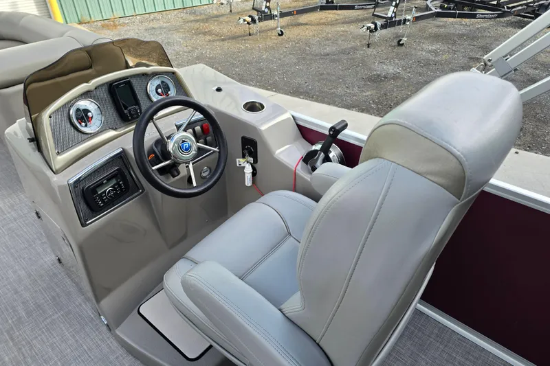 Slide: The Image of Steering console of 2017 Premier 220 SunSation boat with gauges and controls. - 19