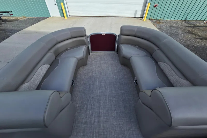 Slide: The Image of Luxurious seating on 2017 Premier 220 SunSation pontoon boat, featuring elegant gray upholstery. - 25
