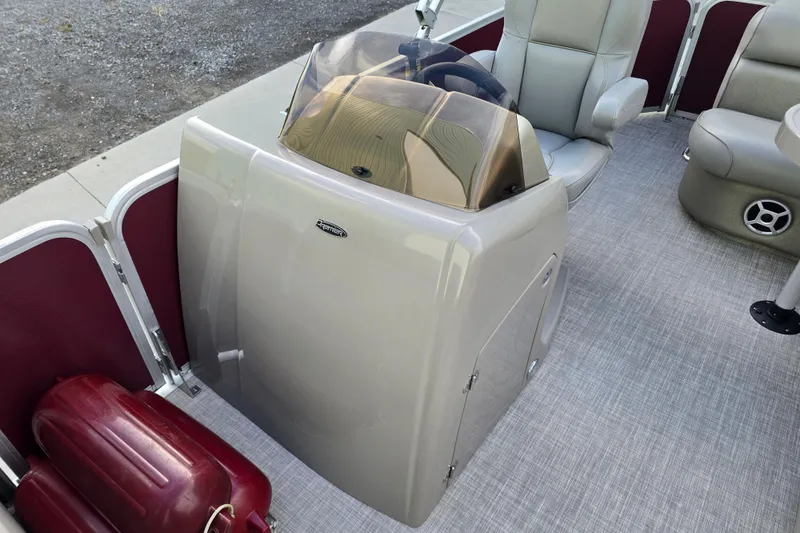 Slide: The Image of Luxurious seating area on 2017 Premier 220 SunSation pontoon boat with table and cup holders. - 29