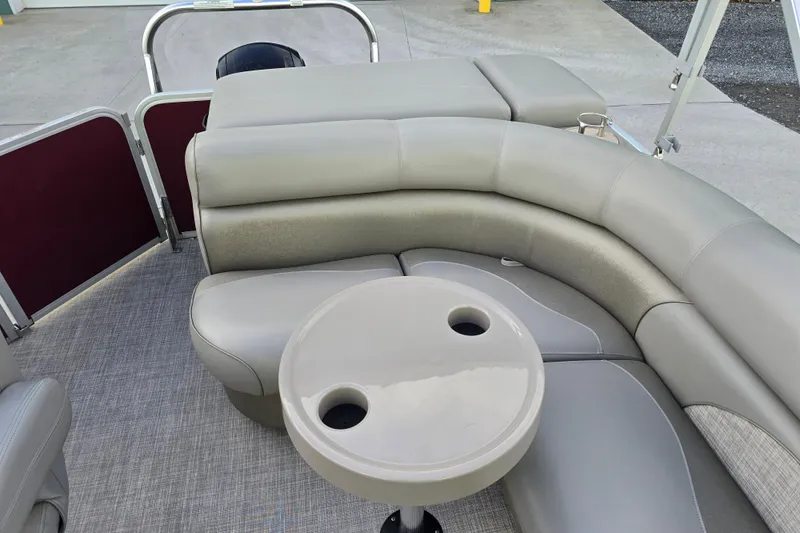Slide: The Image of 2017 Premier 220 SunSation boat helm with steering wheel, gauges, and comfortable captain's chair. - 31