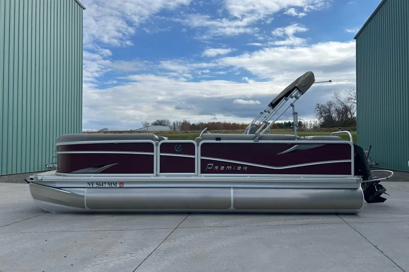 Slide: The Image of Close-up of a 2017 Premier 220 SunSation pontoon tube on concrete surface. - 34