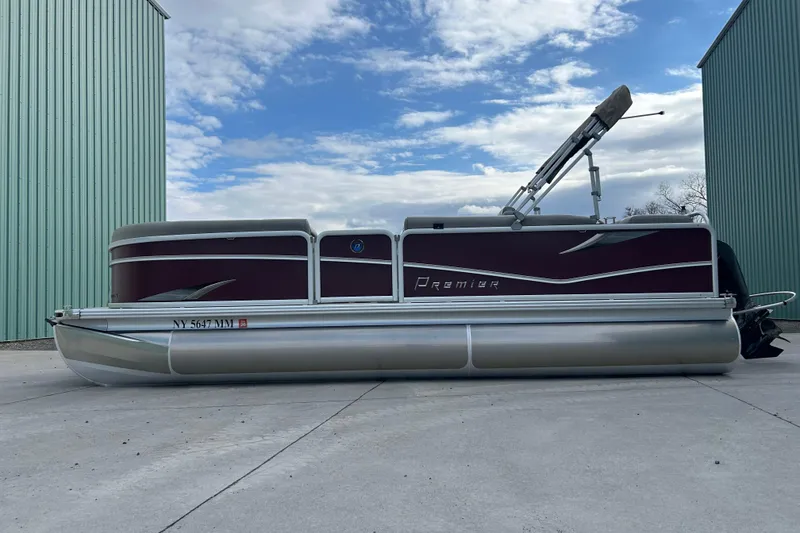 Slide: The Image of 2017 Premier 220 SunSation pontoon boat parked outside a large building. - 37