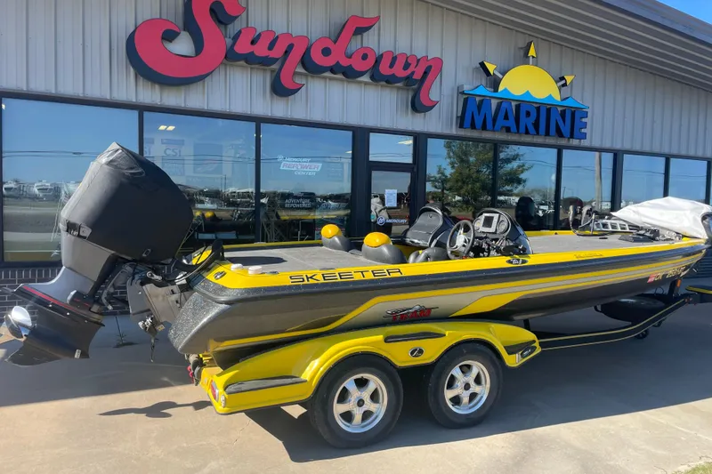 Slide: The Image of 2008 Skeeter 20i boat in yellow, parked outside Sundown Marine dealership. - 0