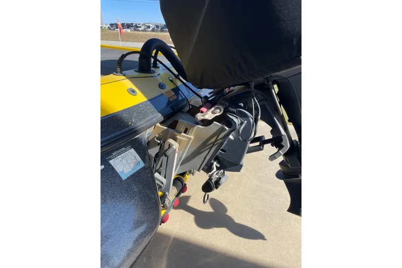 Slide: The Image of 2008 Skeeter 20i boat motor and transom detail, featuring yellow and black components. - 10