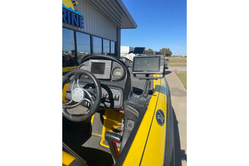 Slide: The Image of 2008 Skeeter 20i boat dashboard with steering wheel and navigation equipment. - 4