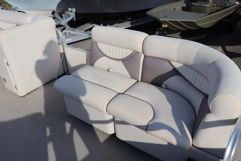 Slide: The Image of 2008 Sweetwater 2186RE boat interior with white cushioned seating. - 3