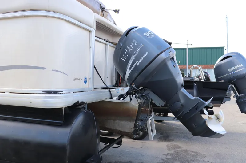 Slide: The Image of 2008 Sweetwater 2186RE pontoon boat with Yamaha outboard motor, parked on a trailer. - 9