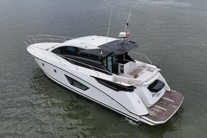 Slide: The Image of 2018 Beneteau Gran Turismo 50 yacht cruising on calm waters. - 10