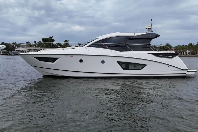 Slide: The Image of 2018 Beneteau Gran Turismo 50 yacht on calm water under cloudy sky. - 15