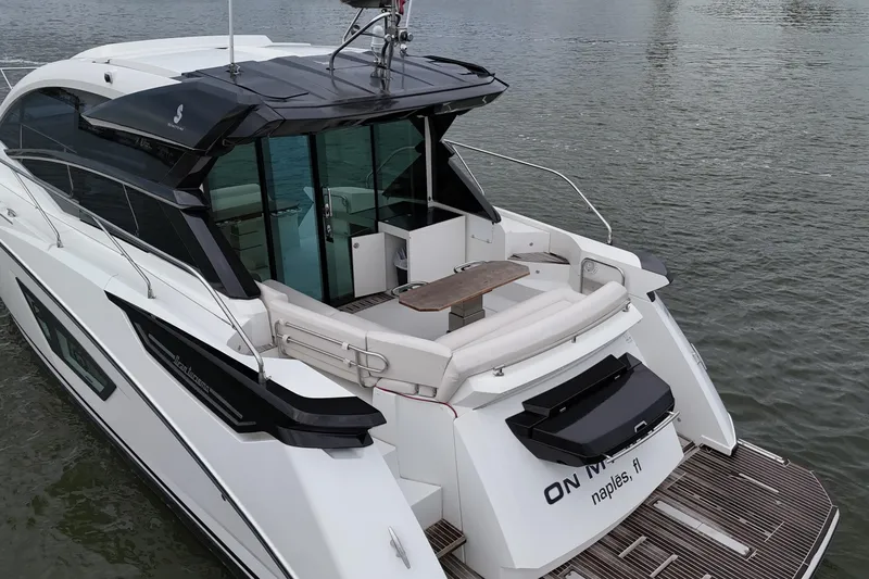 Slide: The Image of 2018 Beneteau Gran Turismo 50 yacht on water, rear view with seating area. - 21