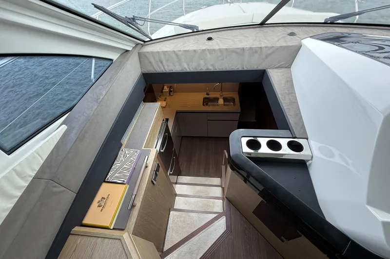 Slide: The Image of Interior view of 2018 Beneteau Gran Turismo 50 yacht, featuring modern kitchen and sleek design. - 33