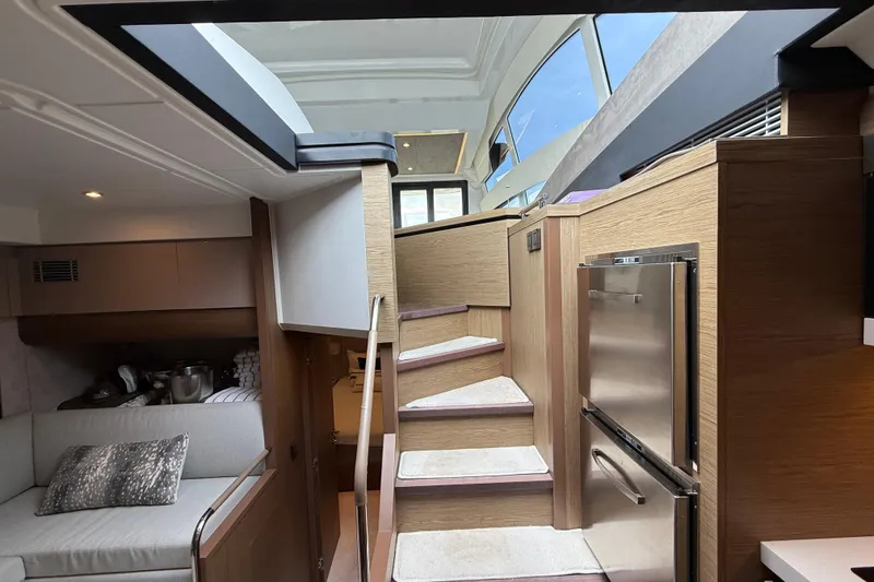 Slide: The Image of Interior of 2018 Beneteau Gran Turismo 50 yacht with modern design and wooden finishes. - 36